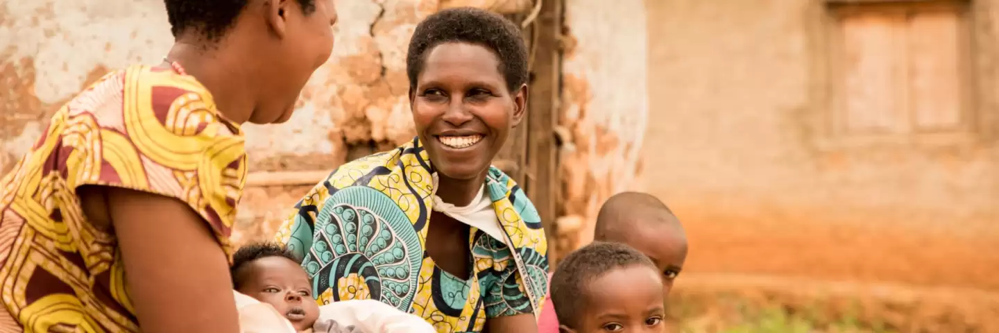 Two Burundian women with their children