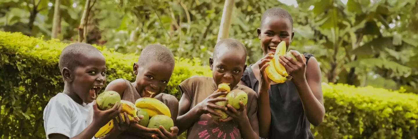Florence and Samuel's Children posing with fresh fruit