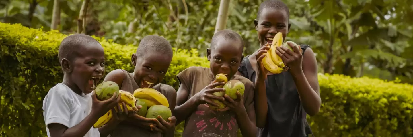 Florence and Samuel's children posing with fruit