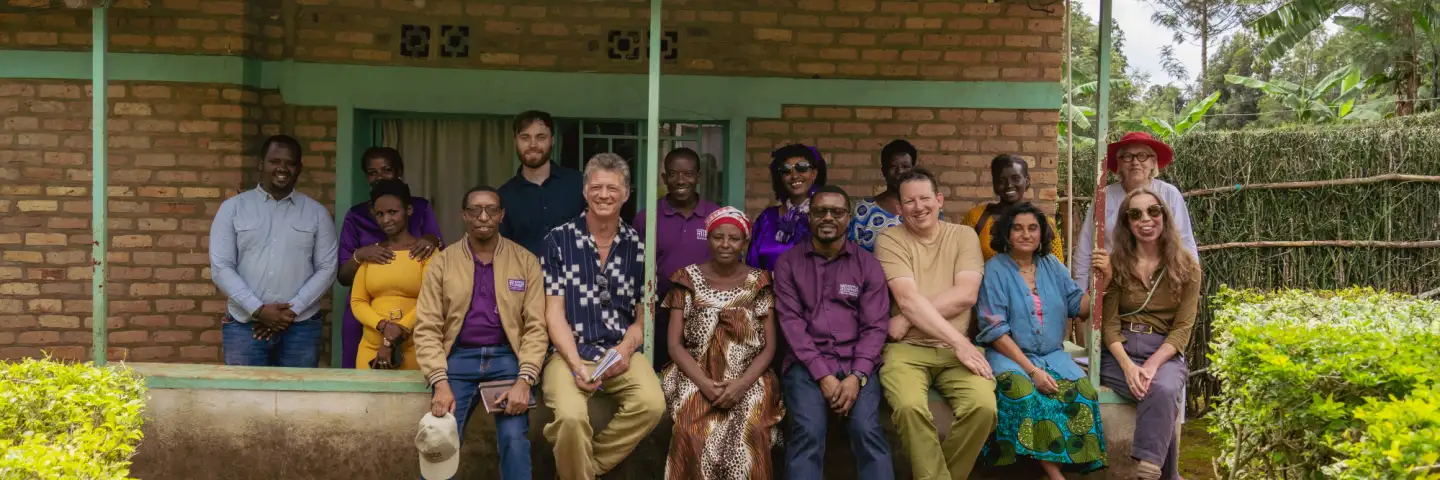 Ripple Effect staff, partners and project participants sitting for a photo