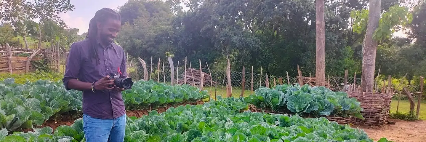 Antony Kahaya, taking photos on the field