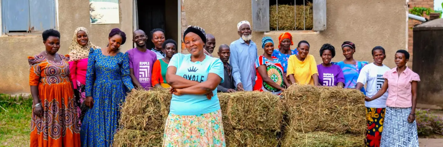 Group of Ugandan people smiling proudly towards the camera