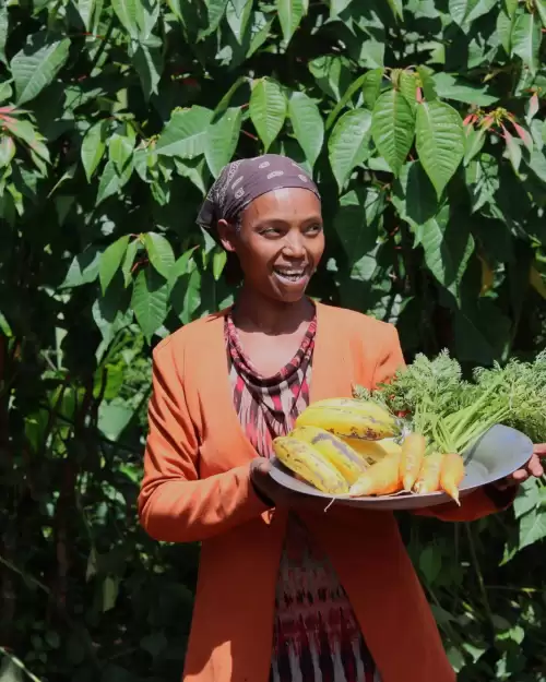 Amaracholdi with her banana and carrot crops