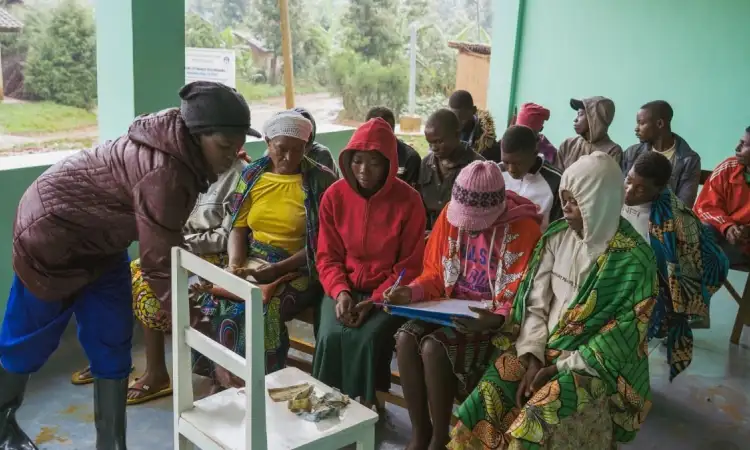 Community members gathered during a group session in rural Africa