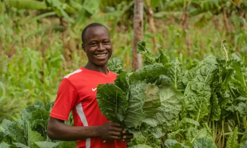 Christine and Titus' son Aaron on their farm