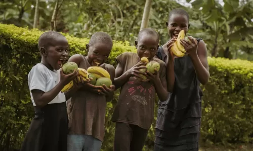 Florence and Samuel's children posing with fruit