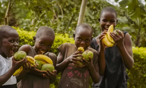 Florence and Samuel's children posing with fruit