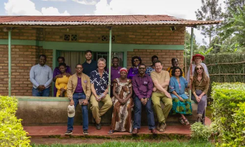 Ripple Effect staff, partners and project participants sitting for a photo