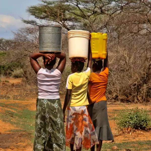 Women in Zambia, carrying water