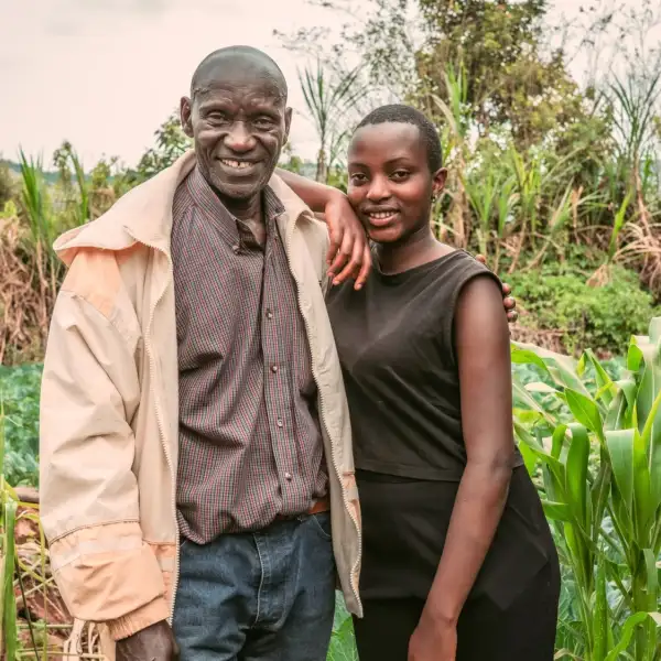 Zoe and her father, arm in arm in their field