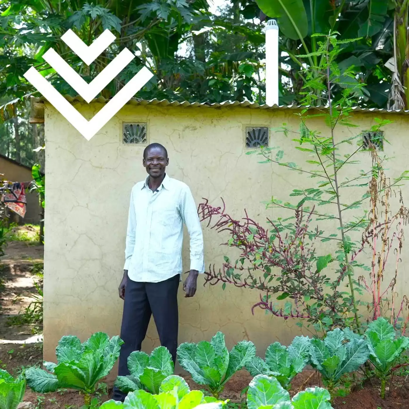 Ripple Effect farmer standing outside his latrine