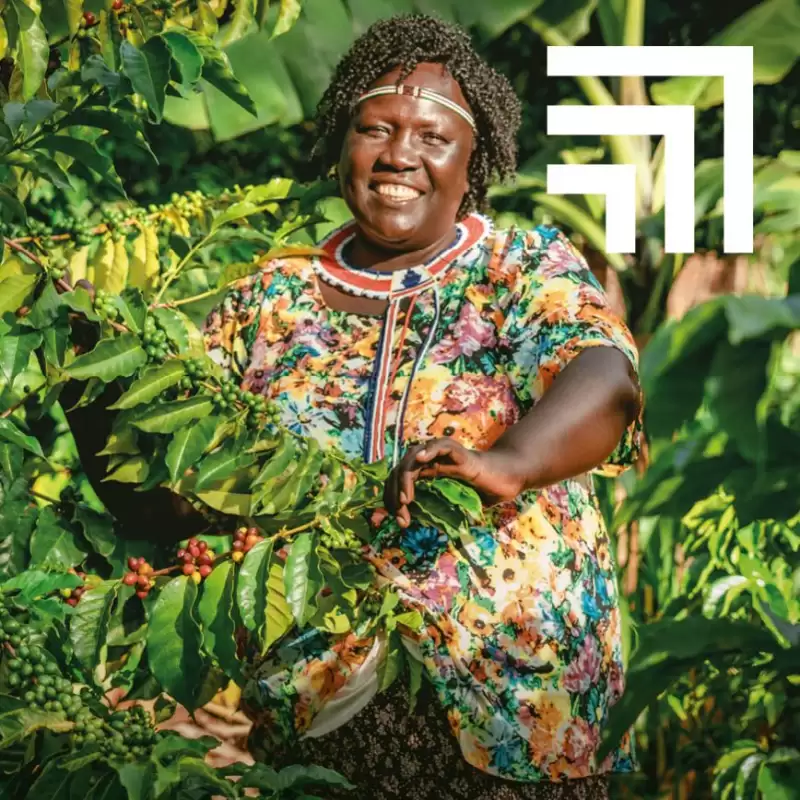 Woman standing with her coffee tree