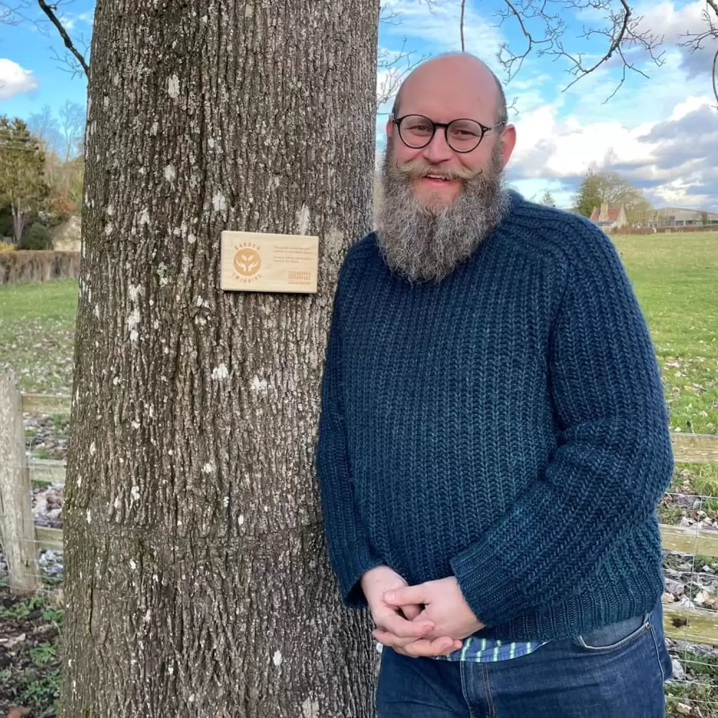 Garden twinning plaque on a tree next to Ripple Effect supporter